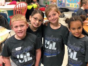 4 students smiling